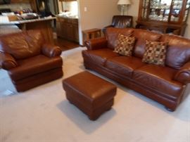Leather Sofa/couch, reclining chair and ottoman. Leather chair in corner, china cabinet