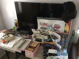 Mid-size flat-screen, fully working, with some Mini Cooper and other car toys and memorabilia -- lots of that stuff!