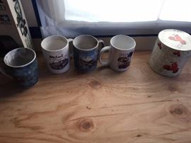 A few of our scooter- and car-related coffee mugs.  Soot wipes off.