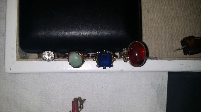 From left to right, 1)sterling and CZ 2) 14k and Jade 3)14K Saphire 4)Sterling and Amber