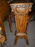 Intricately carved plant stand. Do not know age.