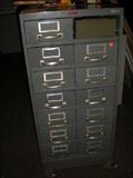 This old file cabinet is on wheels that lock.