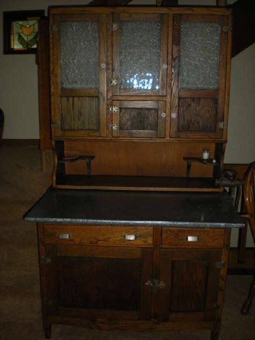 Oak Kitchen Cabinet with metal top and hinged bread box inside lower door. Excellent condition.