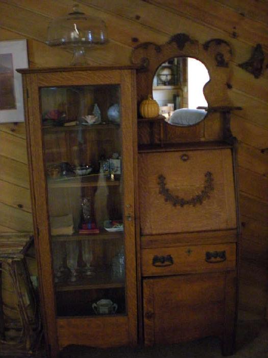 Oak Secretary.Carved and appliqued. Drop leaf glass front with mirror.  Excellent condition.