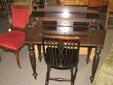 Wonderful writing desk that folds down flat for table appearance. Writing desk slides out. Includes matching chair.