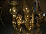 Size ranging from 18" to 30" gold cherubs with musical instruments.