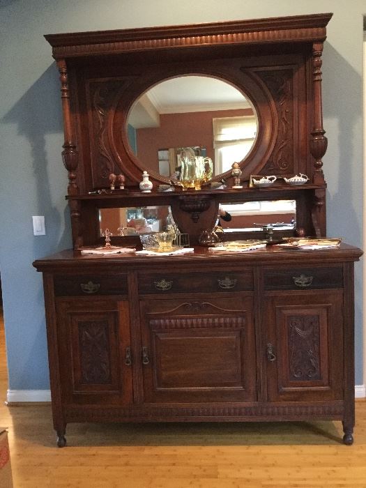 English Sideboard Buffet with lovely carvings, lots of storage  including pull out dividers below, a true antique in excellent condition
