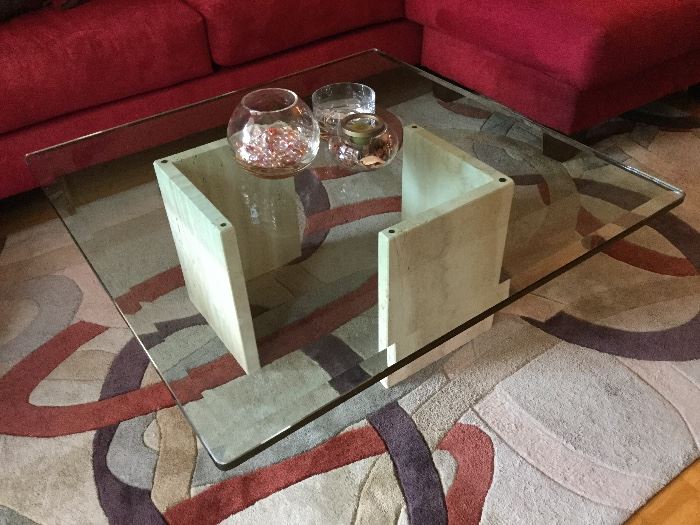 Marble base glass top coffee table and area rug