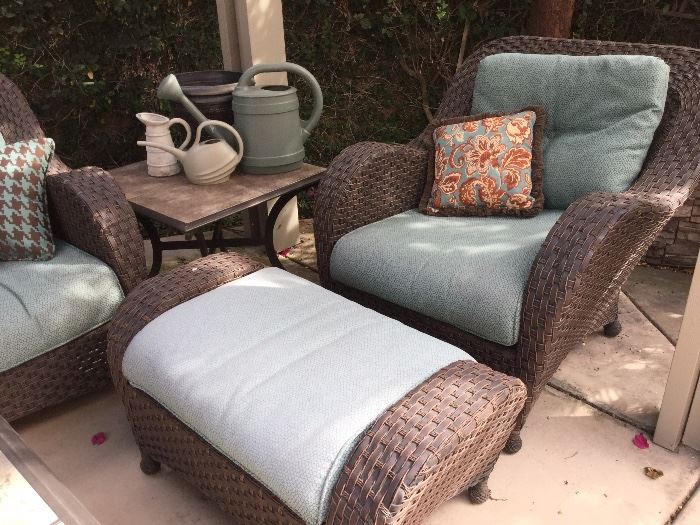 One of two patio deluxe chair and ottoman and side table from the Martha Stewart collection