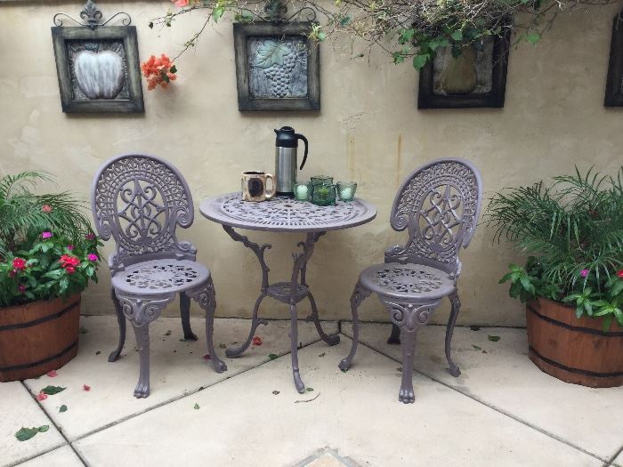 Fancy Metal ice cream style patio table and chairs, perfect for that morning wake up while the birds sing, and the garbage trucks roll, also 3-4 plants formthat perfect patio decor, you can have the attachment for drip watering with each