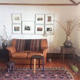 F&T Modern Italian Leather Loveseat, Kilim rug, Mexican Folk Art fish, beautiful decorator vases, framed photographs taken around the world...