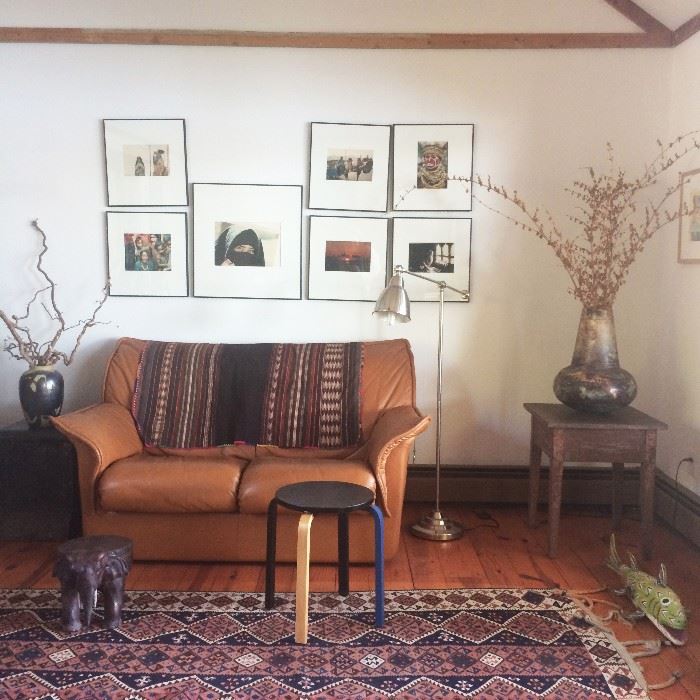 F&T Modern Italian Leather Loveseat, Kilim rug, Mexican Folk Art fish, beautiful decorator vases, framed photographs taken around the world...