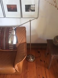 Sofa detail with vintage Peruvian woven textile, chrome floor lamp
