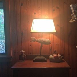 Found fish lamp atop one of two antique bureaus / night stands