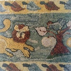 Hooked rug wall hanging with lion scene