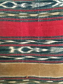 Detail of early Guatemalan ikat weaving / wall hanging with natural dyes like indigo