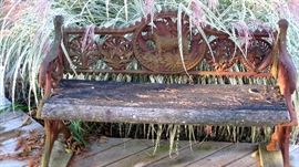 Exceptional folk art bench with casting of dog and birds on the arms. Very unusual.