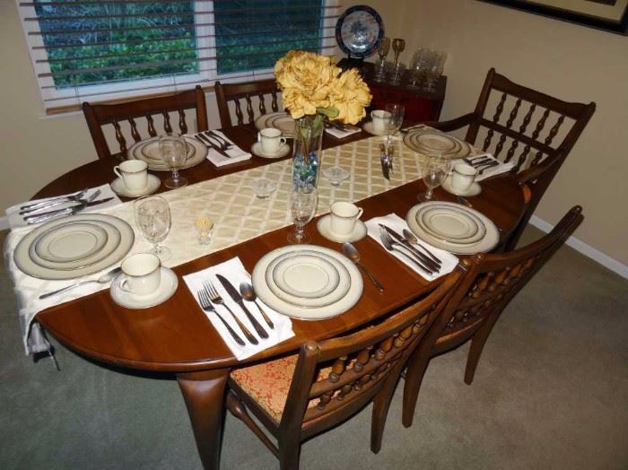 Cherry dining room table with 6 chairs and 2 more leaves(not in table)