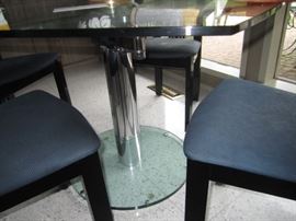 GLASS TOP TABLE THAT SWIVELS OPEN TO 70 INCHES LONG