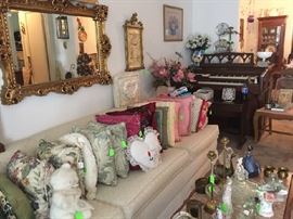 Gold gilt mirror, stuff pillows, Wurlitzer organ, marble top coffee table