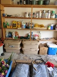 Several bags of black mulch, potting soil, grass seed & more