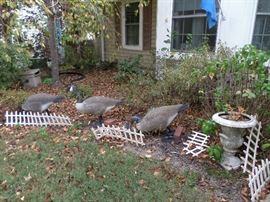 Some of the yard decor and one of the cement planters
