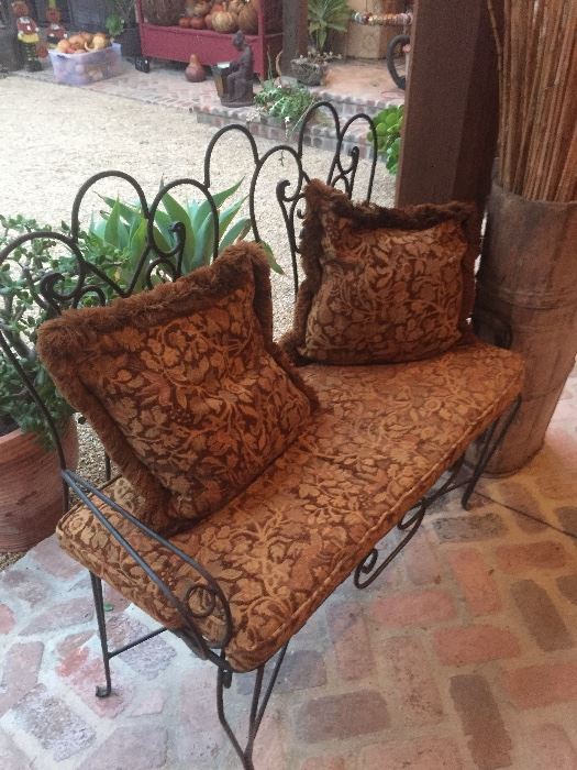 Iron settee with upholstery. 
