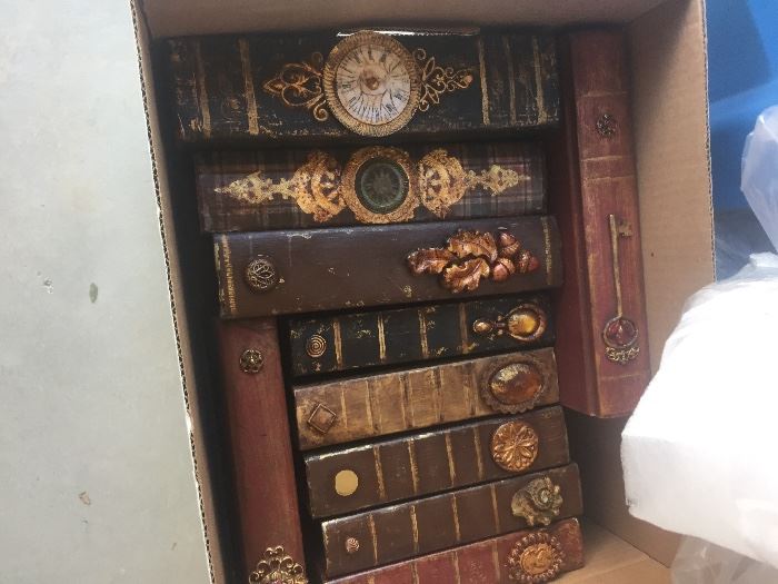 Boxes of antique leather and unusual books.