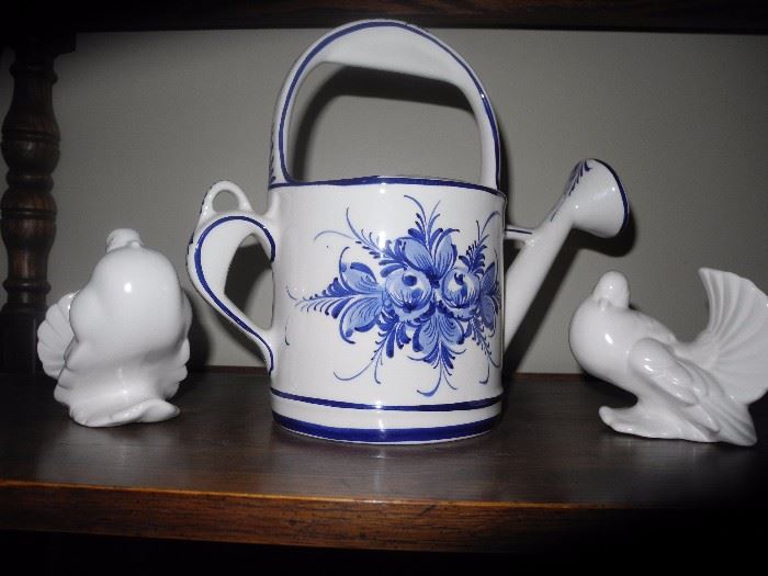 Ceramic watering can and birds