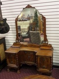 REALLY nice antique dresser with ornate woodwork.