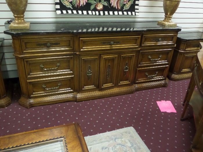 This dresser and nightstands have a marble top - very attractive!  It matches an armoire that we also have in the sale.