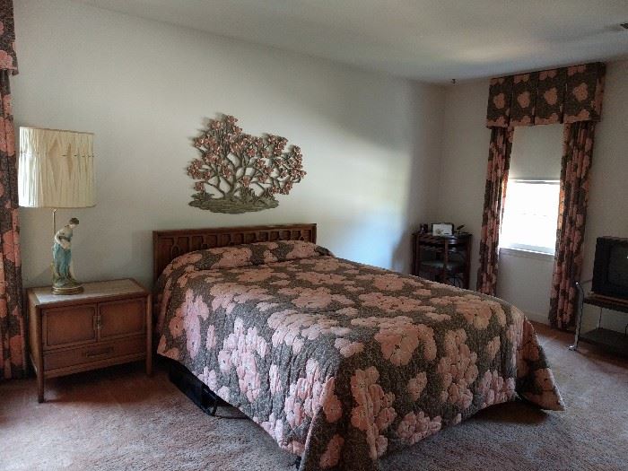 When's the last time you saw a quilted pink and brown quilt with this much love?                                            -- That bed covering, I knoooooow!                                          - The florabuna wonder above the bed, by Syroco Wood.                                                                                     But wait, there's more - a pair of flanking/matching sconces!