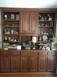 Typical built-in bookcase, filled with Mee Maw trinkets and bobble heads.