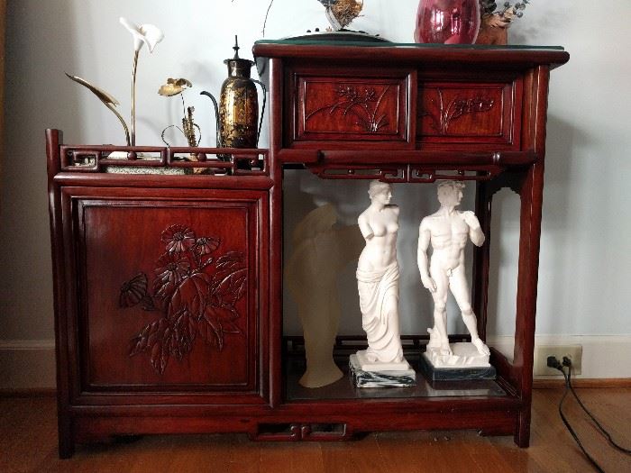 Whoa, my eyes, my eyes! Frontal nudity in cultured marble! Oh, those cheeky Italians! All displayed on a hijacked Asian design asymmetrical cabinet. 