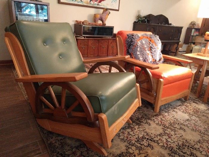 For the Man and Lady of the house, there's a manly green naugahyde rocker and a sensible burnt orange stationary chair, for quiet evenings at home, around the fireplace, knitting and reading. 