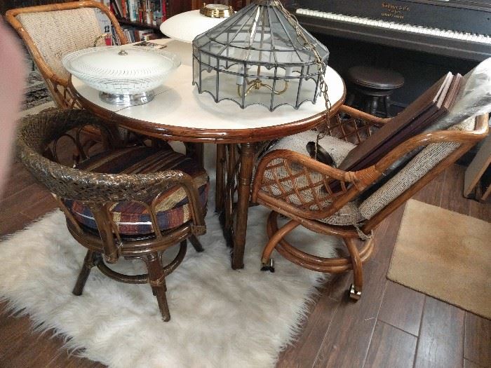 MCM Faux bamboo table & lovely white Formica top (with 2 leaves) and four chairs, by Walter of Wabash, Indiana, begun in 1884. Don't you wanna get nekkid and roll around on that fun-fur rug? There is a proximate fireplace if you get the urge.                                                      We don't charge extra for live entertainment at our sales.