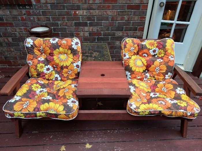 Kitschy outdoor redwood patio furniture. Supply your own umbrella, the recent winds blew it away!