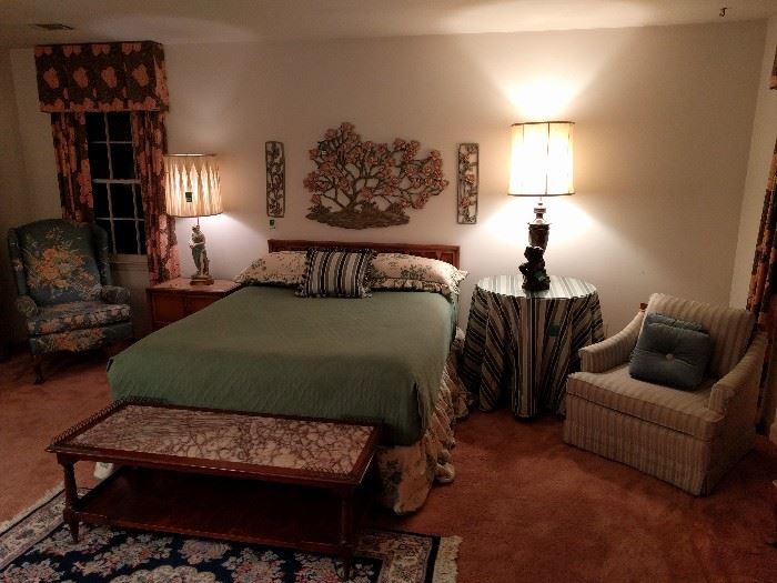 I couldn't stand the floral bed covering, so I switched it for a much more updated look. The mahogany/marble coffee table is spectacular, the figuring in the marble is exceptional.