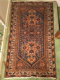 This rug would look best on a wood floor, but it looks great anywhere, even on this pea-green 1970's broadloom crap! This is a Persian Zanjan, 100% wool, hand woven, measuring 5' 3" x 3' 2".