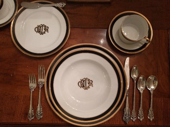 Here's a pic of the Christian Dior "Monogram Black" place setting, with a wonderful paring of Grand Baroque sterling flatware.                                                There's a huge set of the flatware, a combination of Mother's and Grandmother's set. You should see the serving pieces!                                                                            The weight makes them useful for family food fights or when the peaceful dinner conversation turns to politics... 