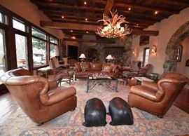 Ralph Lauren Brown Leather Chairs, Leather Pig Foot Stools, Antler Chandelier