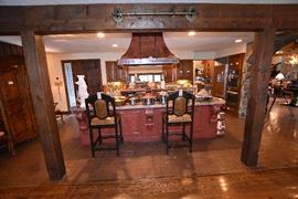 Gourmet Kitchen Complete with Leather Nailhead Hightop Chairs, Hammered Copper Hood Vent, Weathered Brass Horse Head Pot Rack