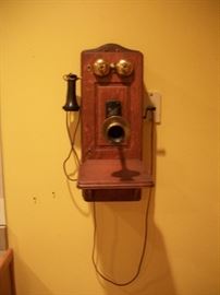 Antique oak wall phone converted into modern phone for use
