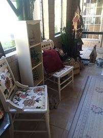 Sun room chairs, birdhouses, and plants