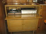 Very cool vintage maple stereo cabinet with Harmon Kardon receiver,  plugged in for your listening pleasure.