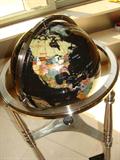 Beautiful gemstone and mother of pearl floor globe.