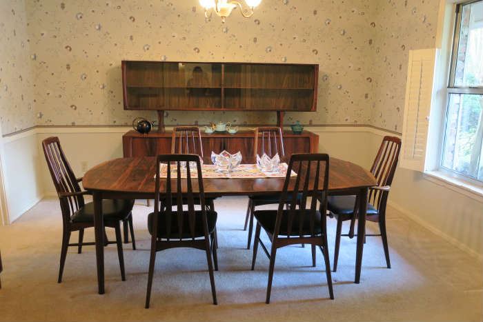 MCM Rosewood Table and (6) Chairs.  Chairs are Koefoeds Homslet with original black vinyl fabric.