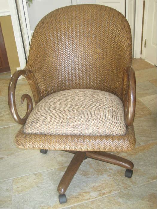 One of four dining chairs on rollers