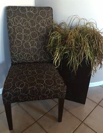 Armless Chair and Faux Plant in Metal Container