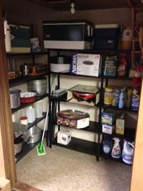 The lower overflow storage closet is full of kitchen ware!
